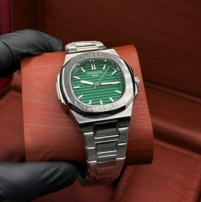 Patek Philippe silver with green dial with date