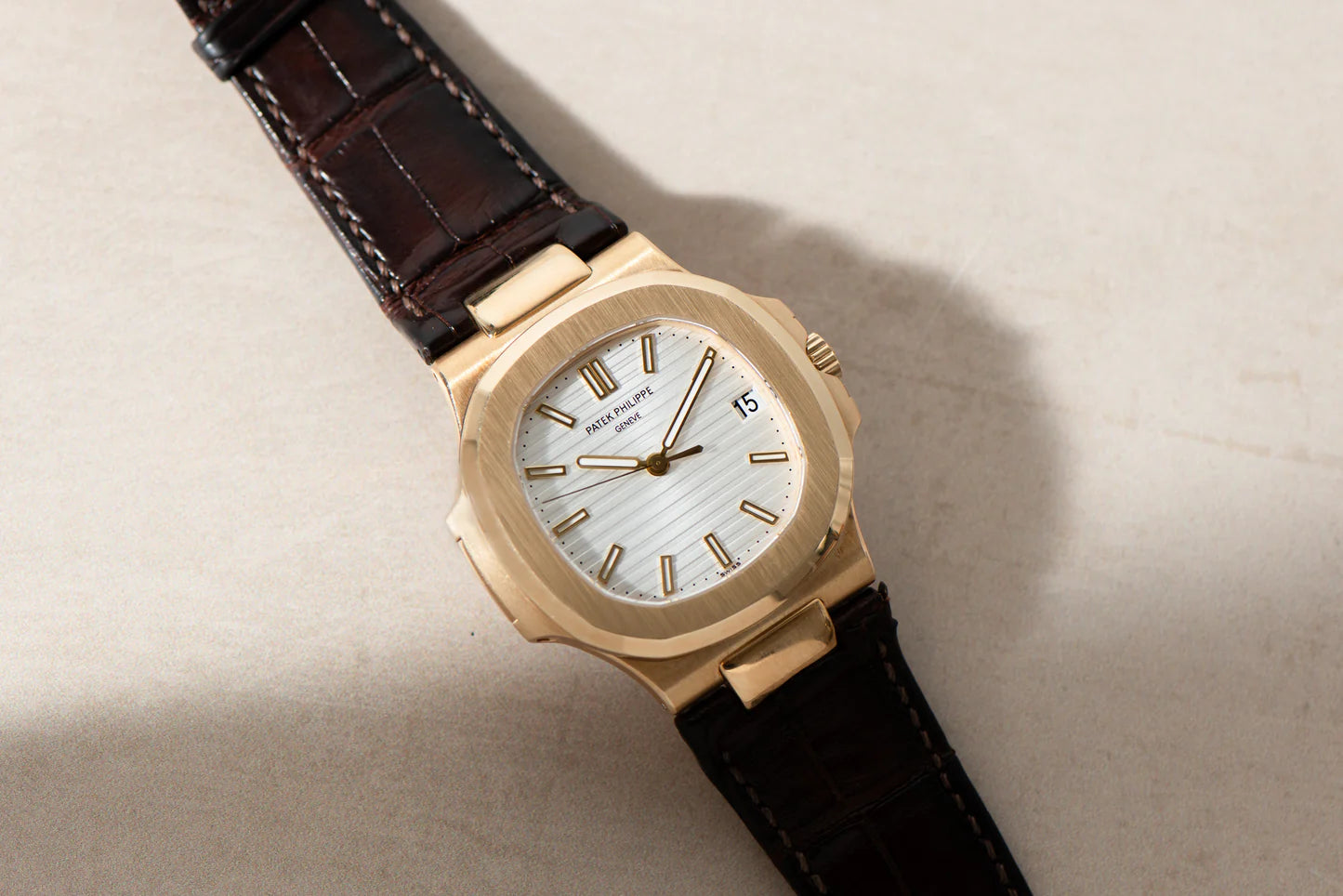 Patek Philippe Nautilus 18K Yellow Gold with brown leather strap watch