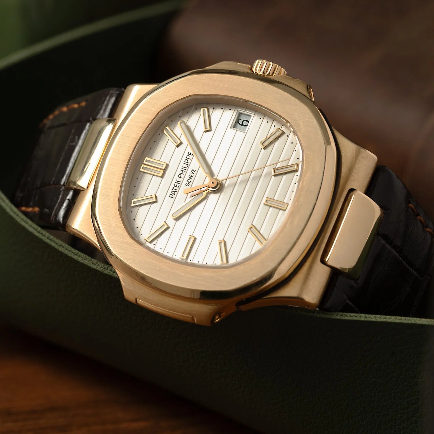 Patek Philippe Nautilus 18K Yellow Gold with brown leather strap watch